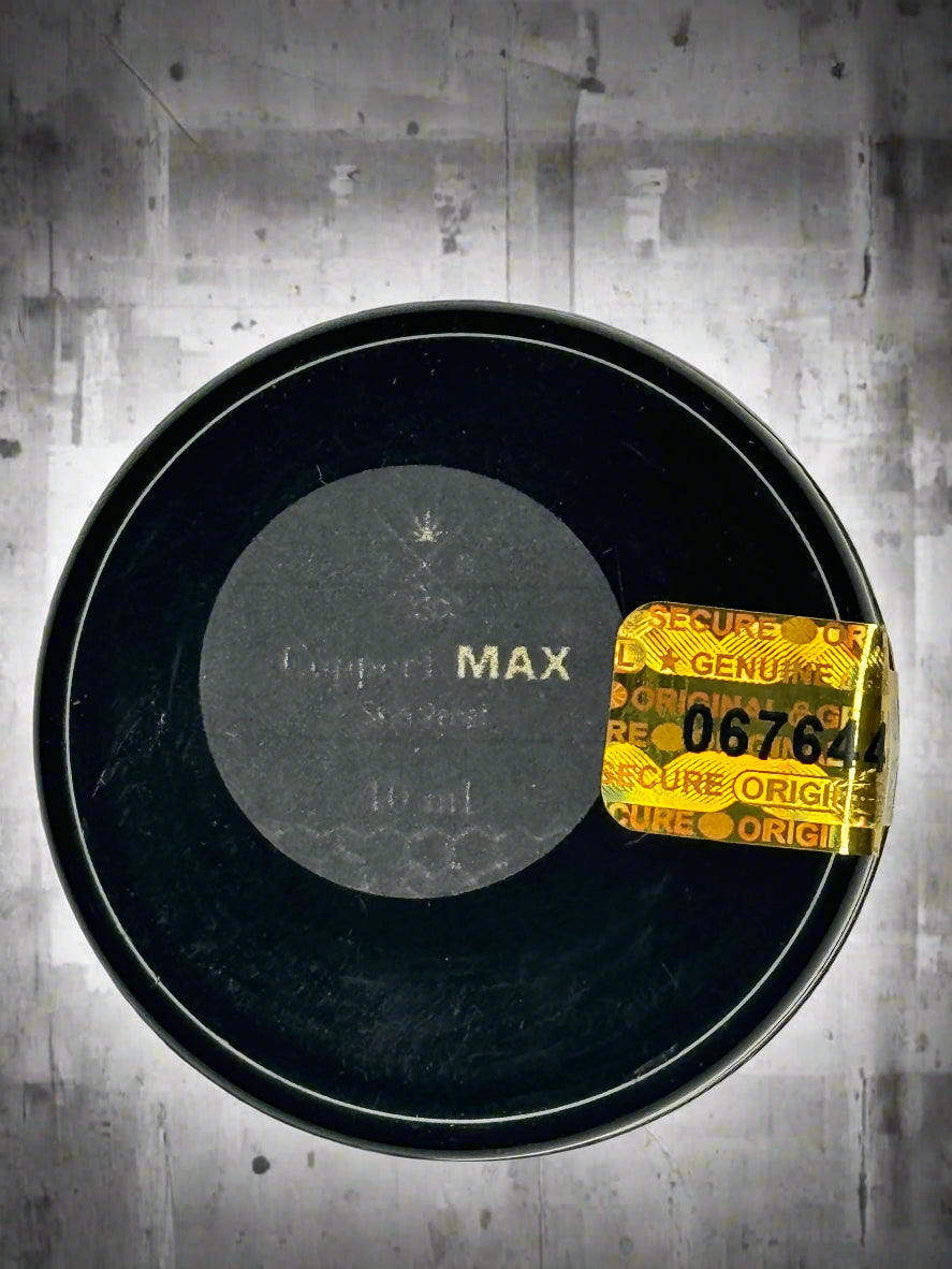 Black container with a gold label on a gray background