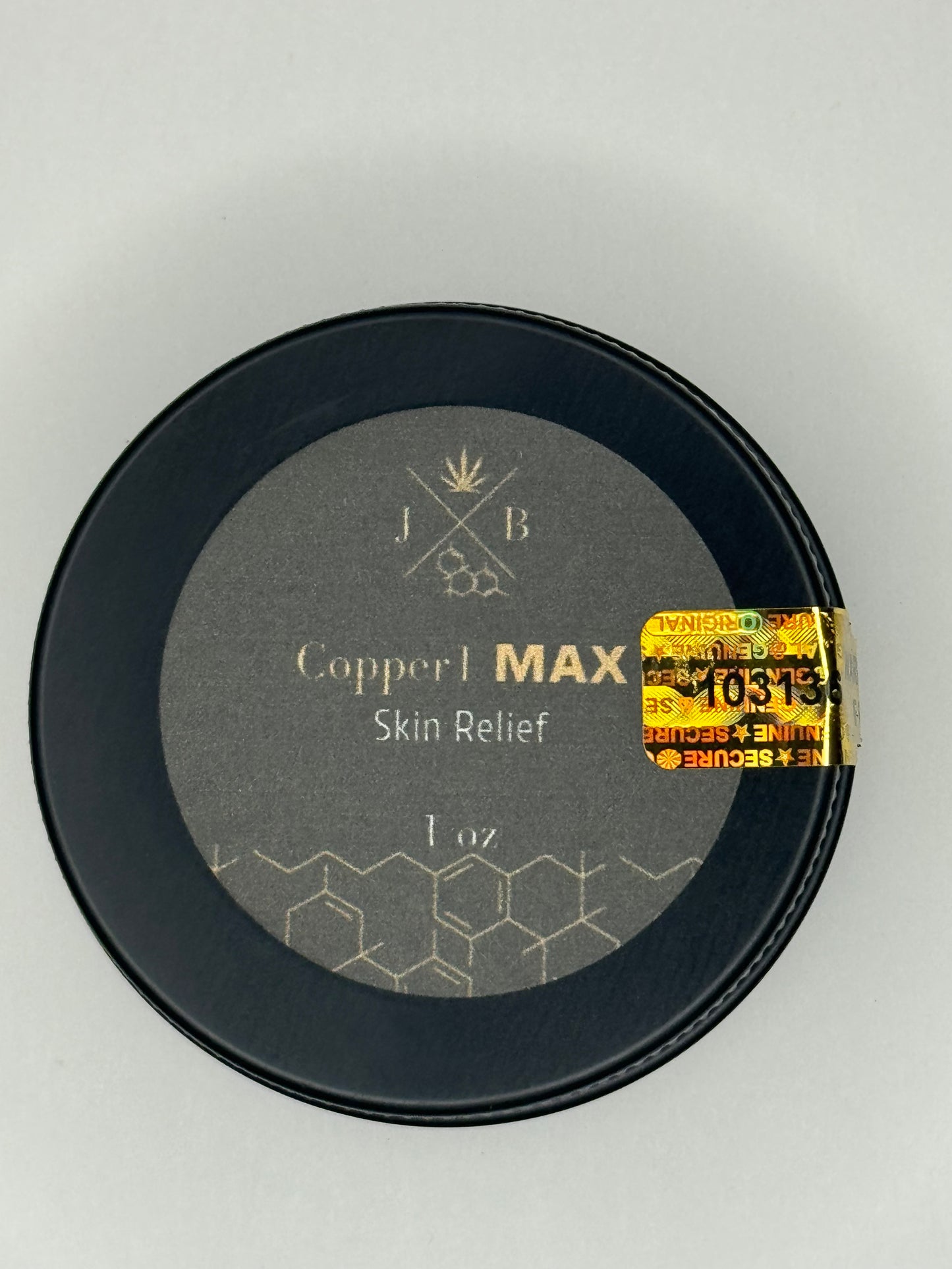 Black container with 'Copper MAX' text on a gray background